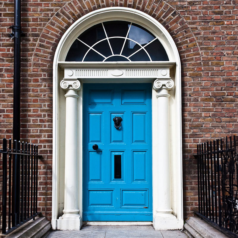 Blue Front Door on a Red Brick House