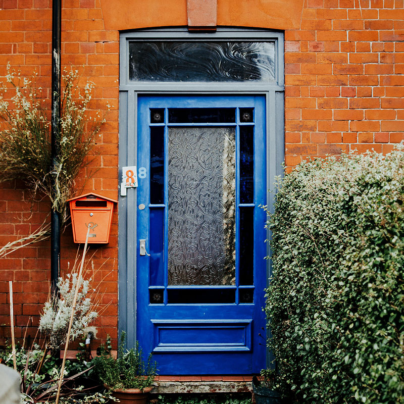 Blue Front Door on a Red Brick House