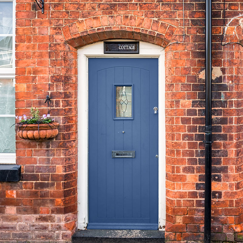 Blue Front Door on a Red Brick House