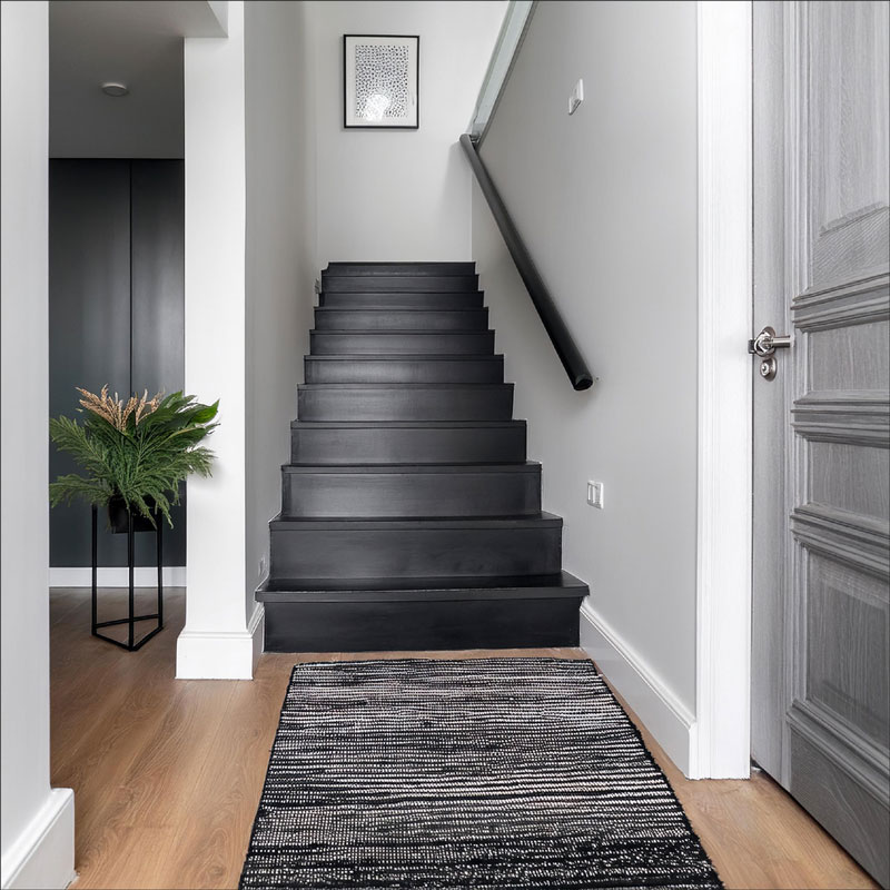 Black and White Hallway with Black Stairs