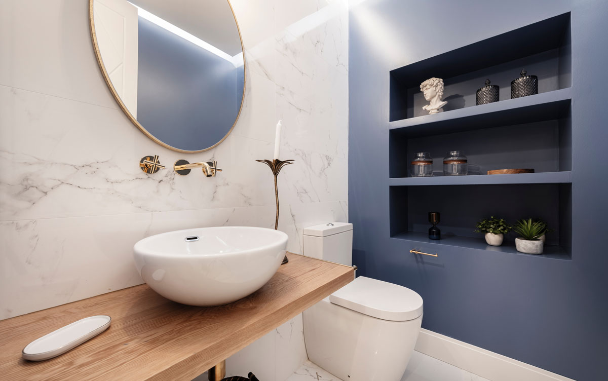 small bathroom feature blue wall with LEDs